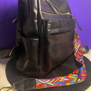 Backpack black with gold accents.